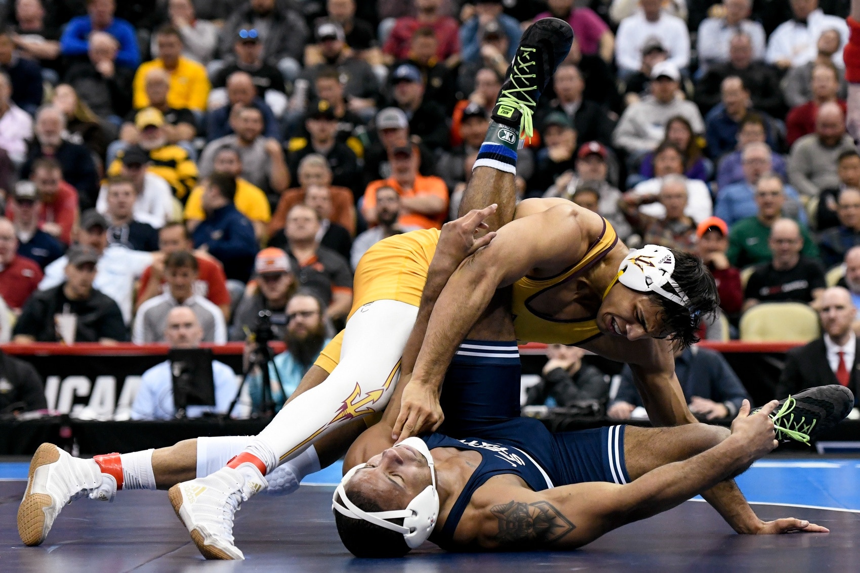 Zahid Valencia wrestles Mark Hall