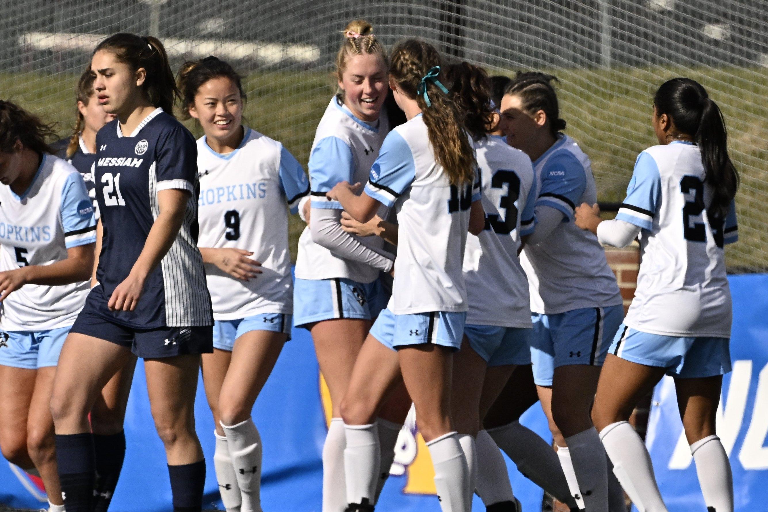 Johns Hopkins women's soccer celebrates against Messiah