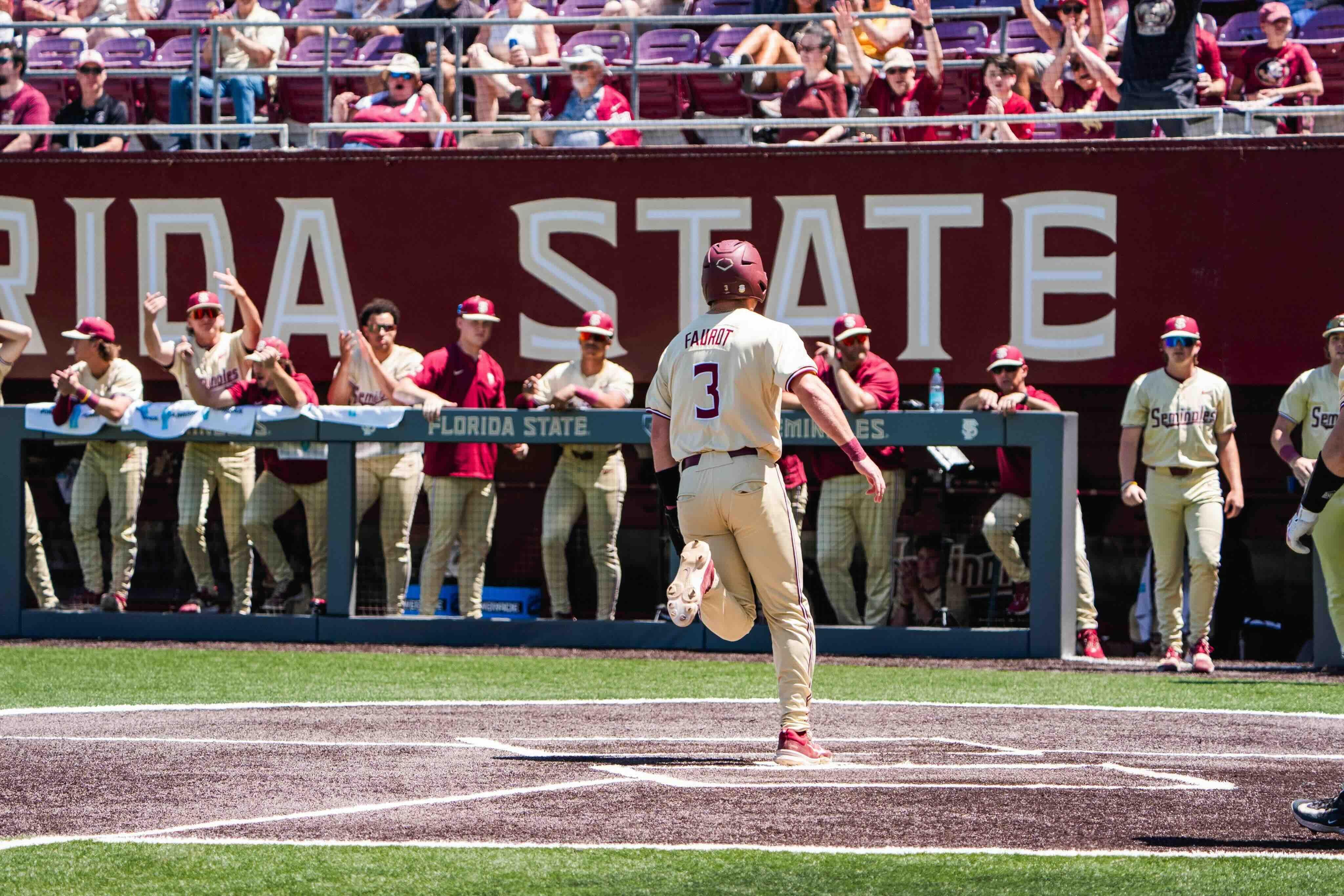 Drew Faurot scores on a wild pitch
