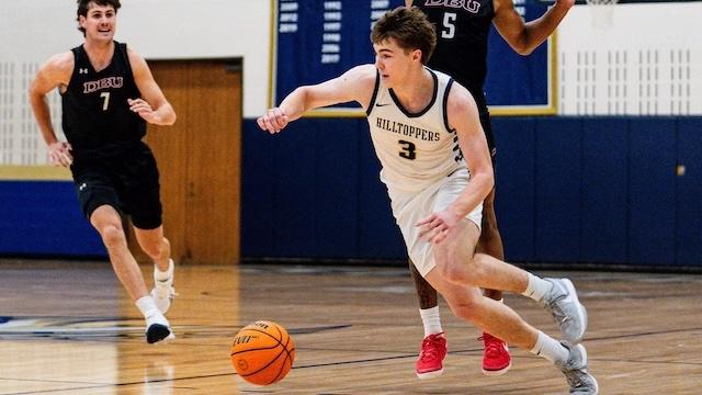 Ryder Bradley drives to the hoop in DII men's basketball. 