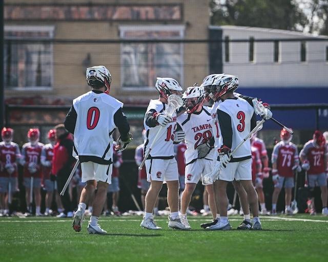 Tampa men's lacrosse celebrate staying perfect on the season.